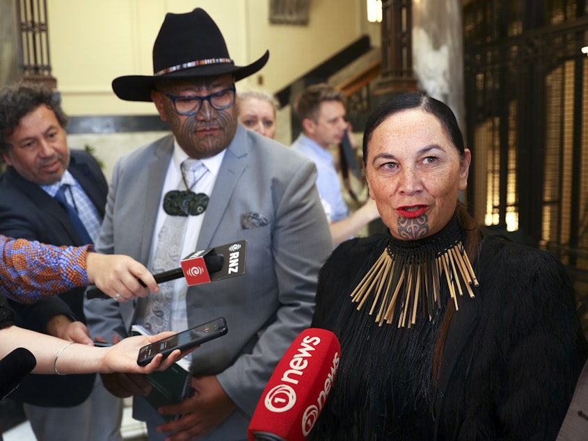 caption: Maori Party co-leaders Rawiri Waititi and Debbie Ngarewa-Packer speak to media during the opening of New Zealand's 53rd Parliament.