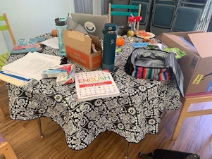 caption: Sacramento Area Congregations Together (Sac ACT) is providing English workbooks so the migrants can learn the language. The group also gives out quarters so they can do laundry.