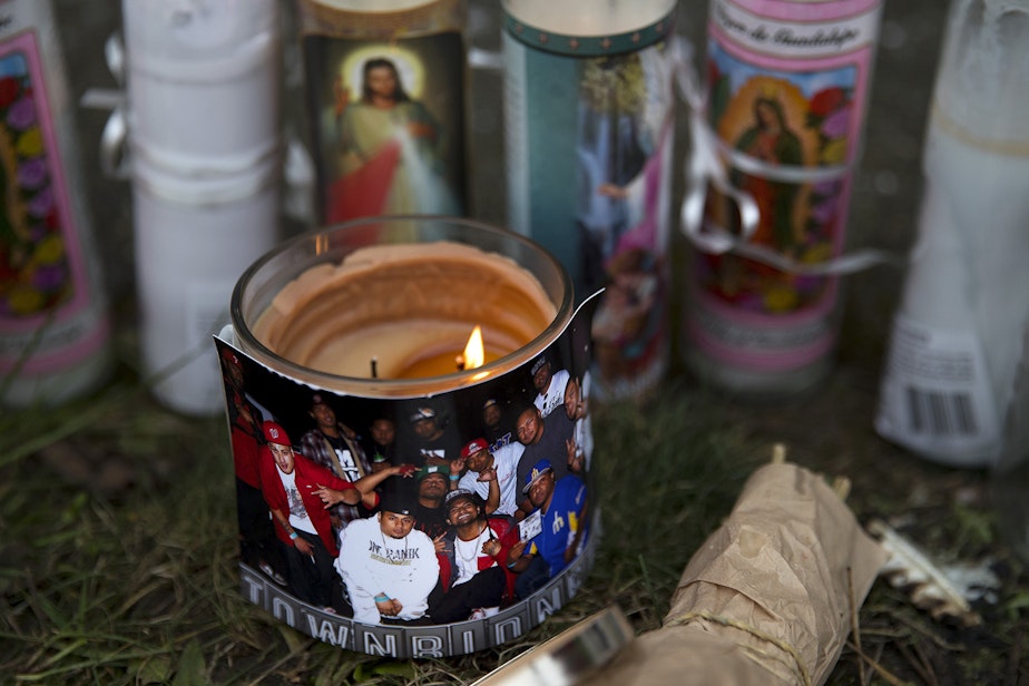 caption: A memorial was set up at the scene where I. Faletogo was killed by Seattle police officers on New Year's Eve.