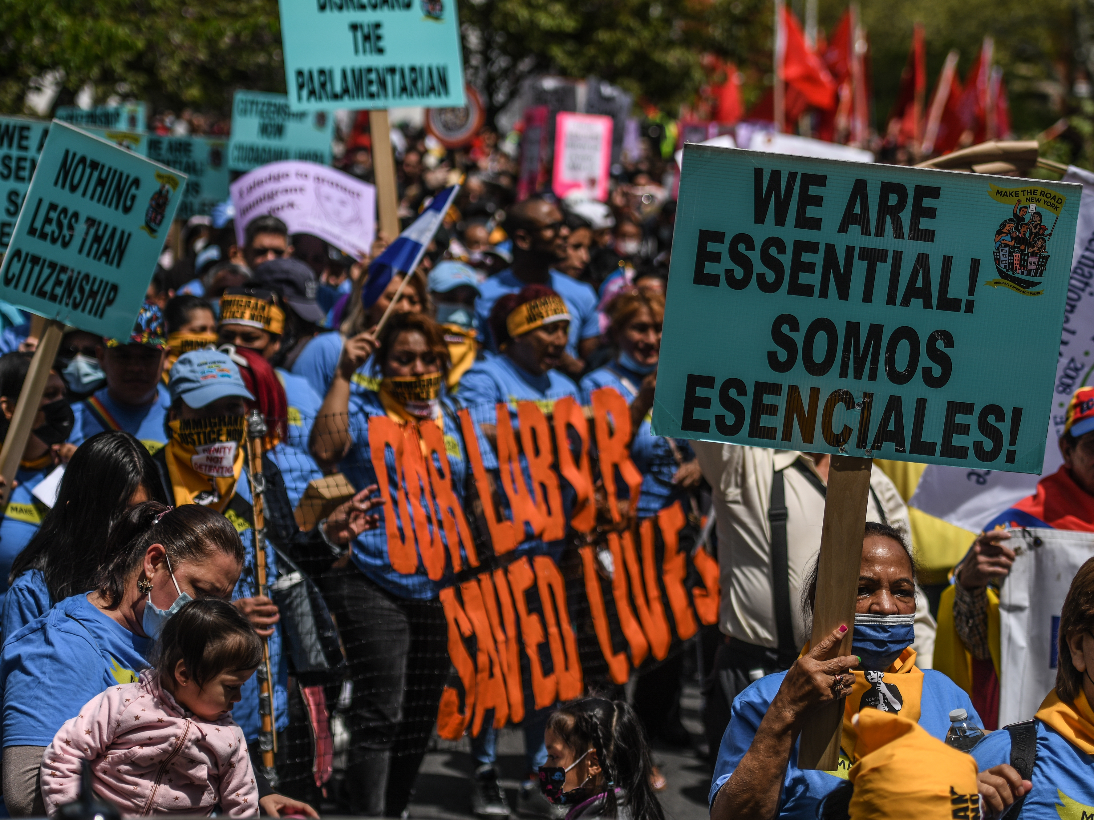 caption: Workers participate in a May Day rally in New York City. Amazon workers recently unionized a facility in Staten Island, emboldening other workers to push for their companies to unionize.