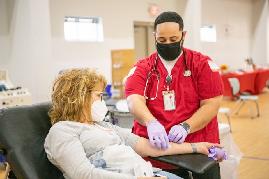caption: Blood centers across the region are actively recruiting to fill phlebotomist vacancies as blood supplies run low.