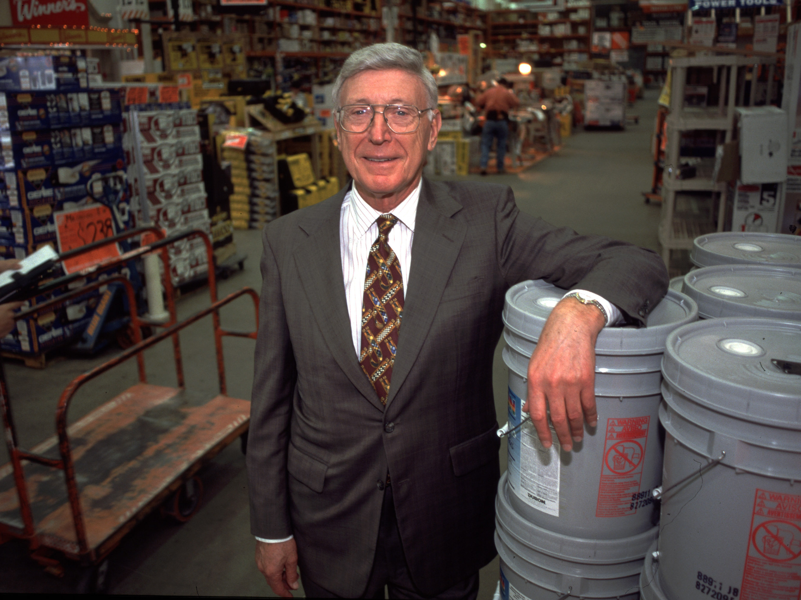 caption: Home Depot co-founder and then-CEO Bernie Marcus poses for a portrait at a store in 1998.