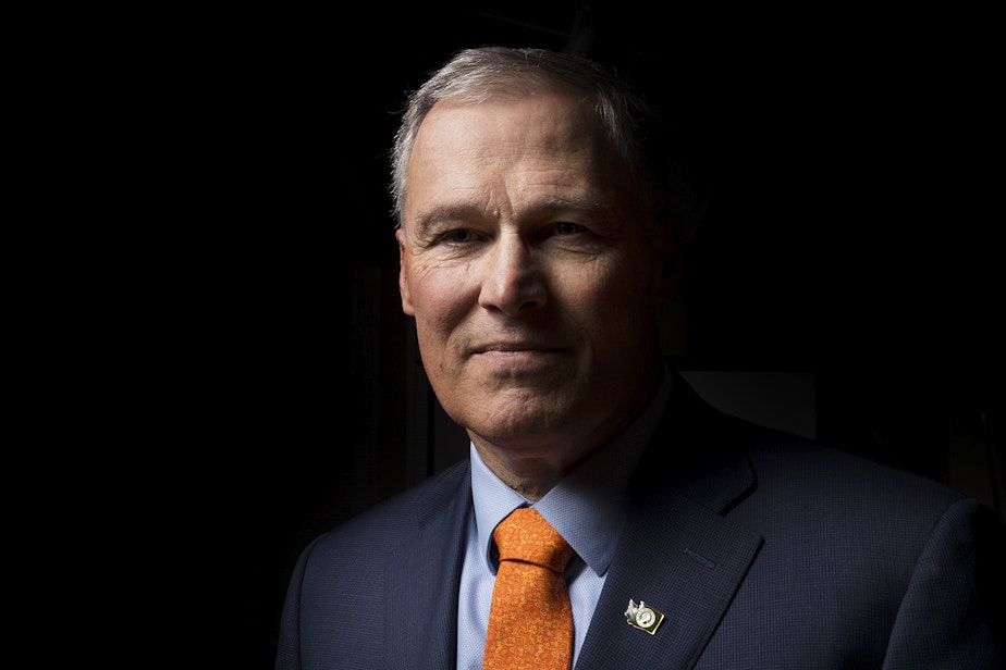 caption: Jay Inslee poses for a portrait on Thursday, January 11, 2018, in Seattle.