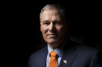 caption: Jay Inslee poses for a portrait on Thursday, January 11, 2018, in Seattle. 