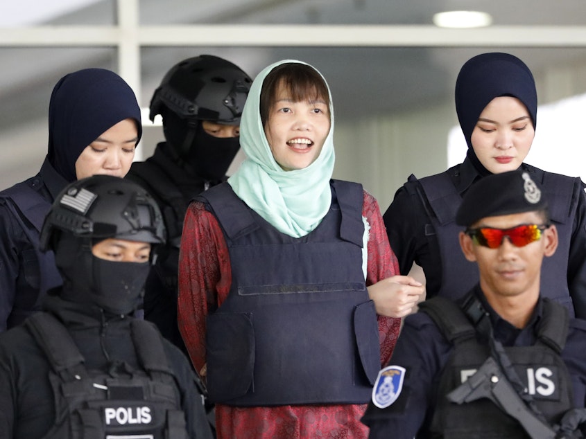 caption: Vietnamese Doan Thi Huong, center, leaves the court in Shah Alam, Malaysia, on Monday.