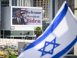 caption: A digital billboard in Tel Aviv welcomes U.S. President Joe Biden to Israel on Wednesday.