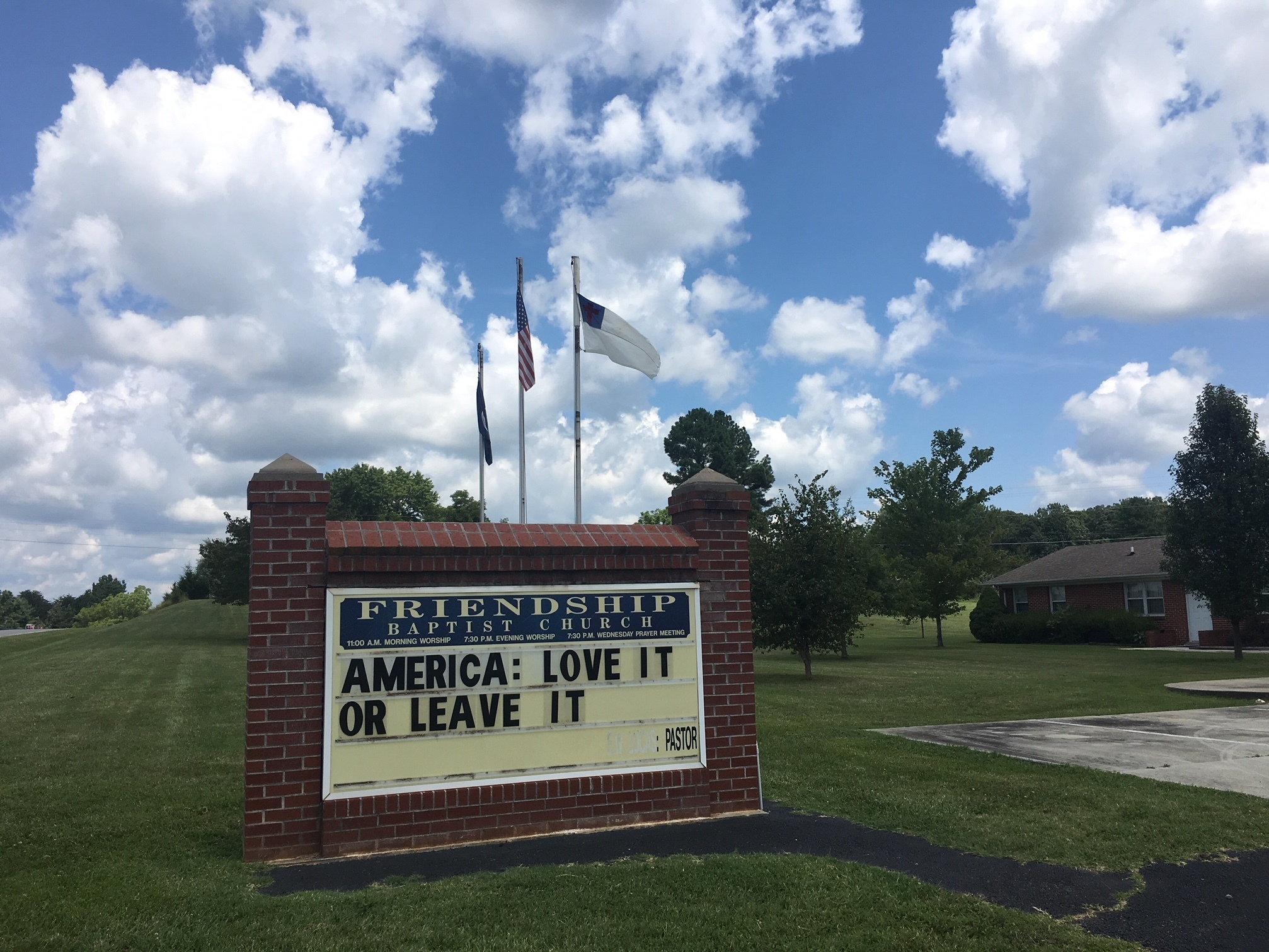 caption: Pastor Earnie Lucas of Friendship Baptist Church in Appomattox, Va., posted this message on his church sign around the same time that President Trump tweeted that four Democratic members of Congress — all women of color — should "go back and help fix the totally broken and crime infested places from which they came."