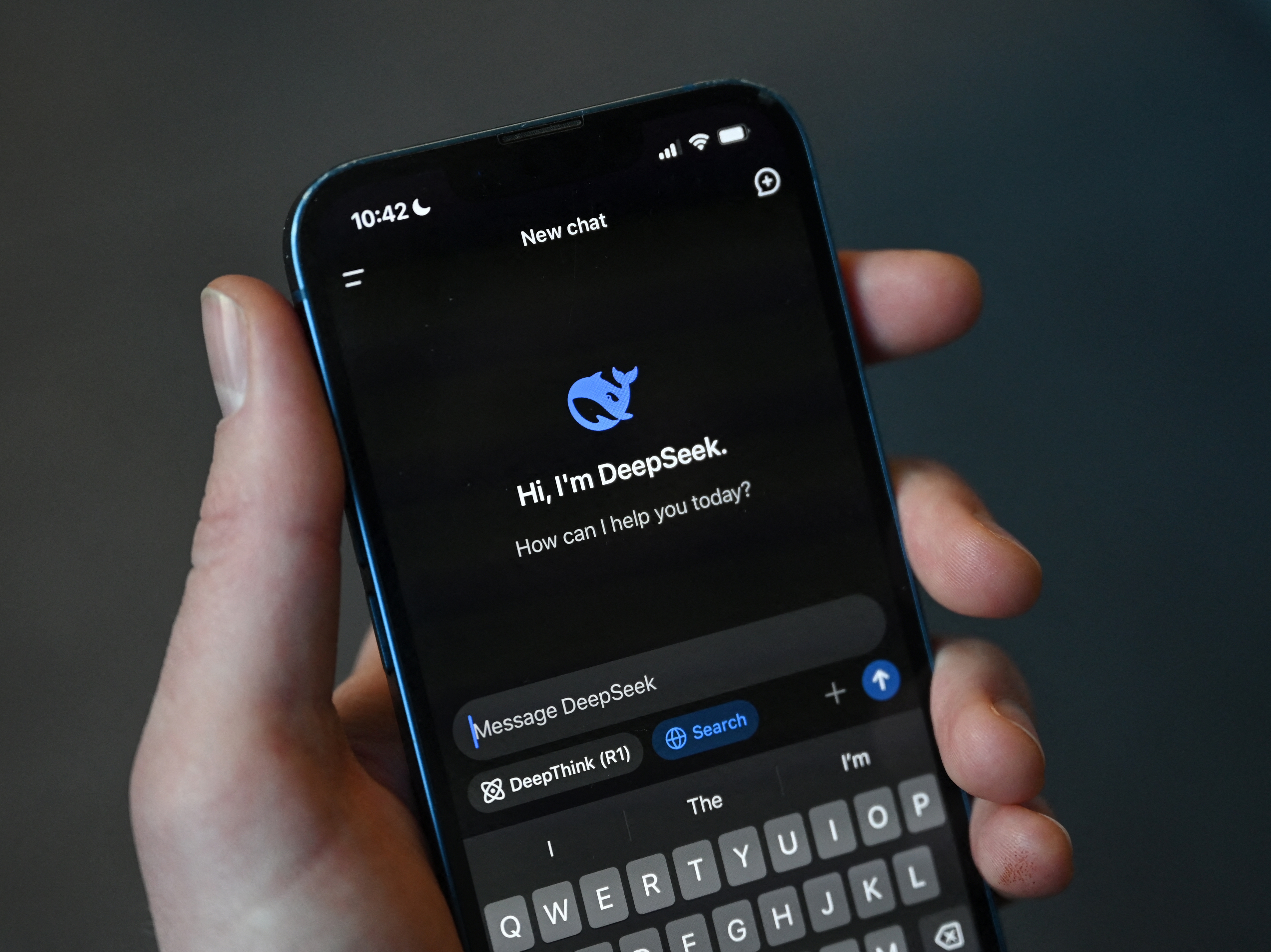 caption: This photo illustration shows the DeepSeek app on a mobile phone in Beijing on January 27, 2025. Chinese firm DeepSeek's artificial intelligence chatbot has soared to the top of the Apple Store's download charts.