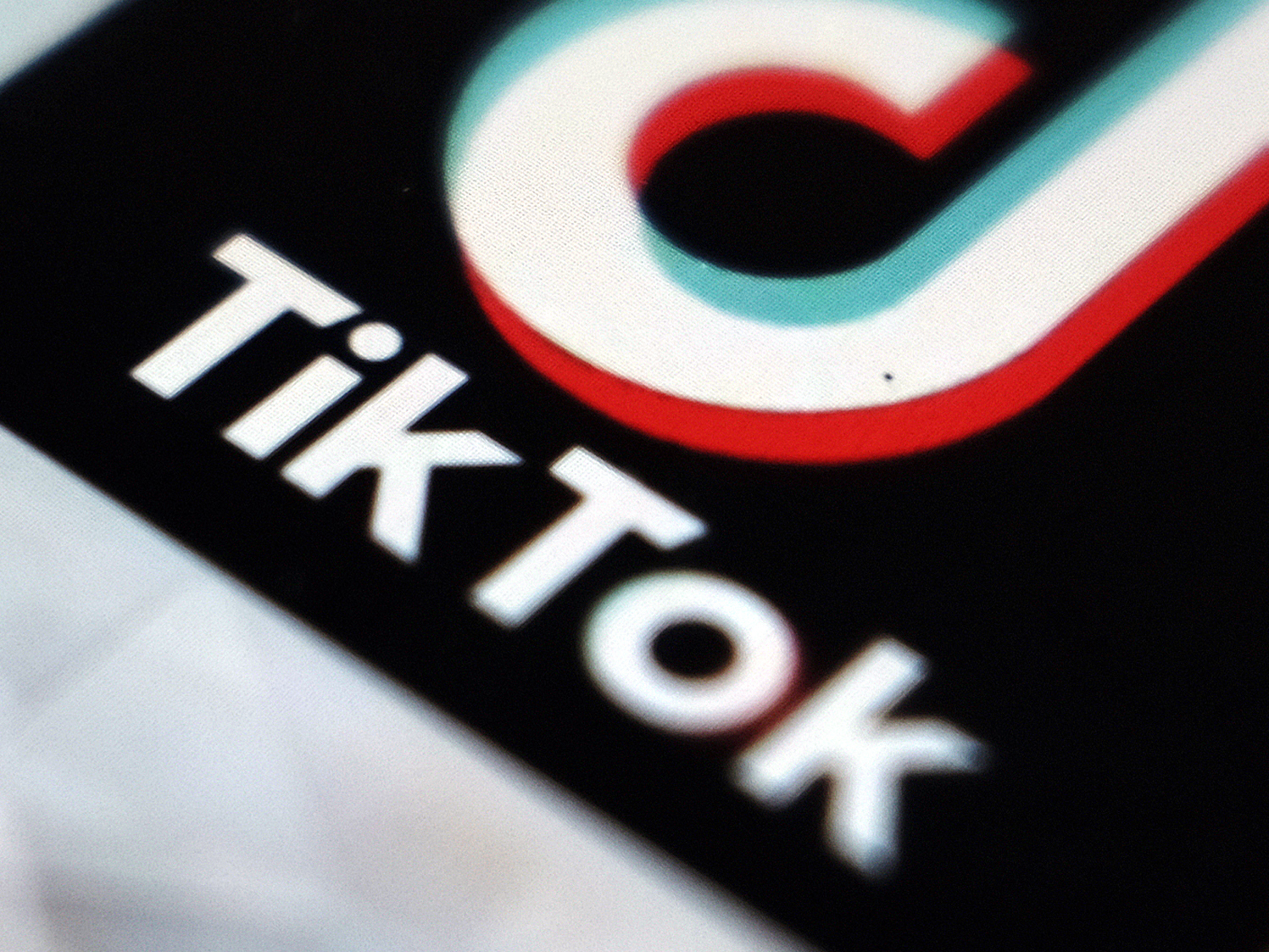caption: A view of the TikTok app logo, in Tokyo.