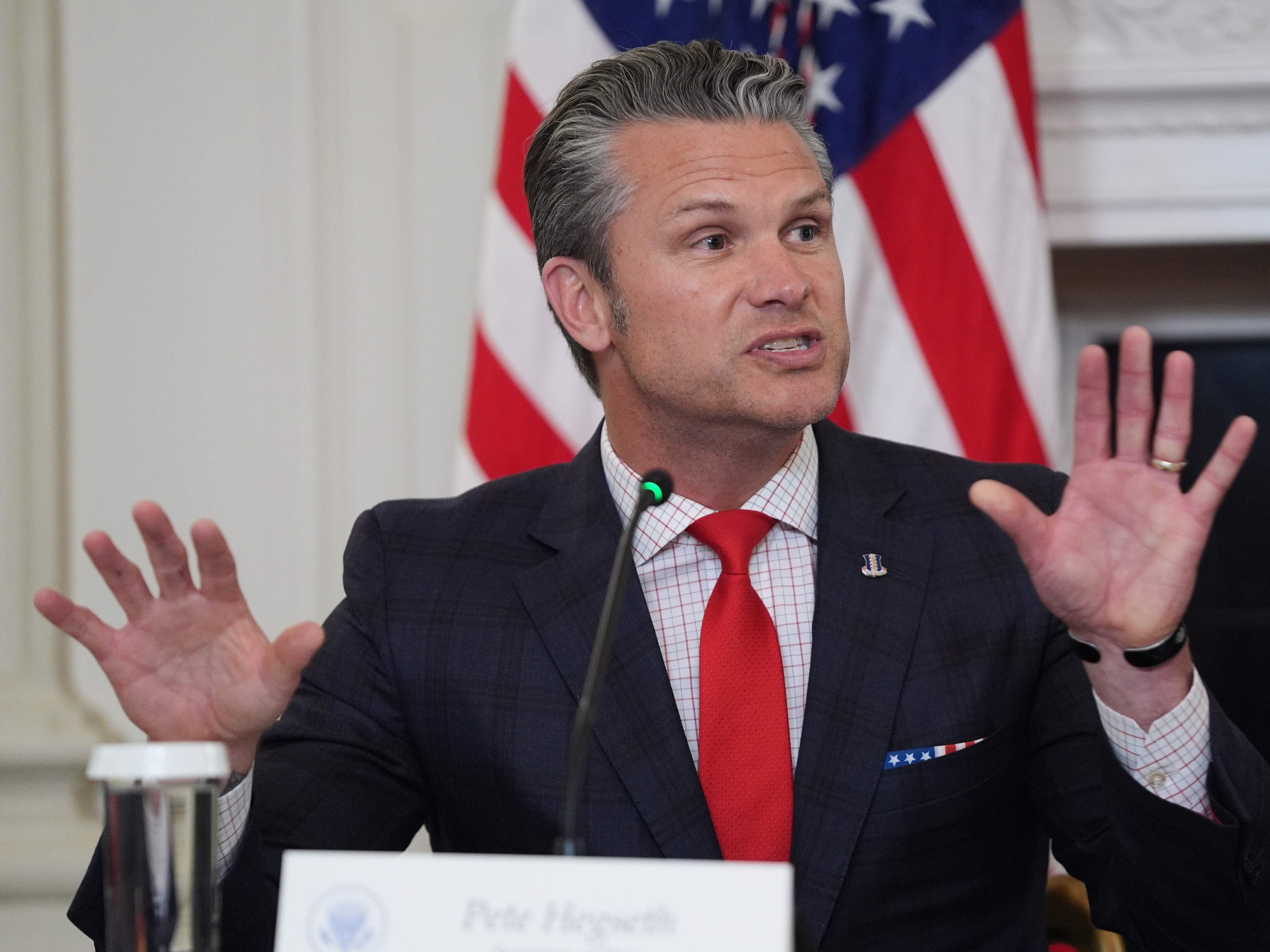 caption: Defense Secretary Pete Hegseth speaks during a roundtable on criminal cartels with President Trump in the State Dining Room of the White House on Thursday.