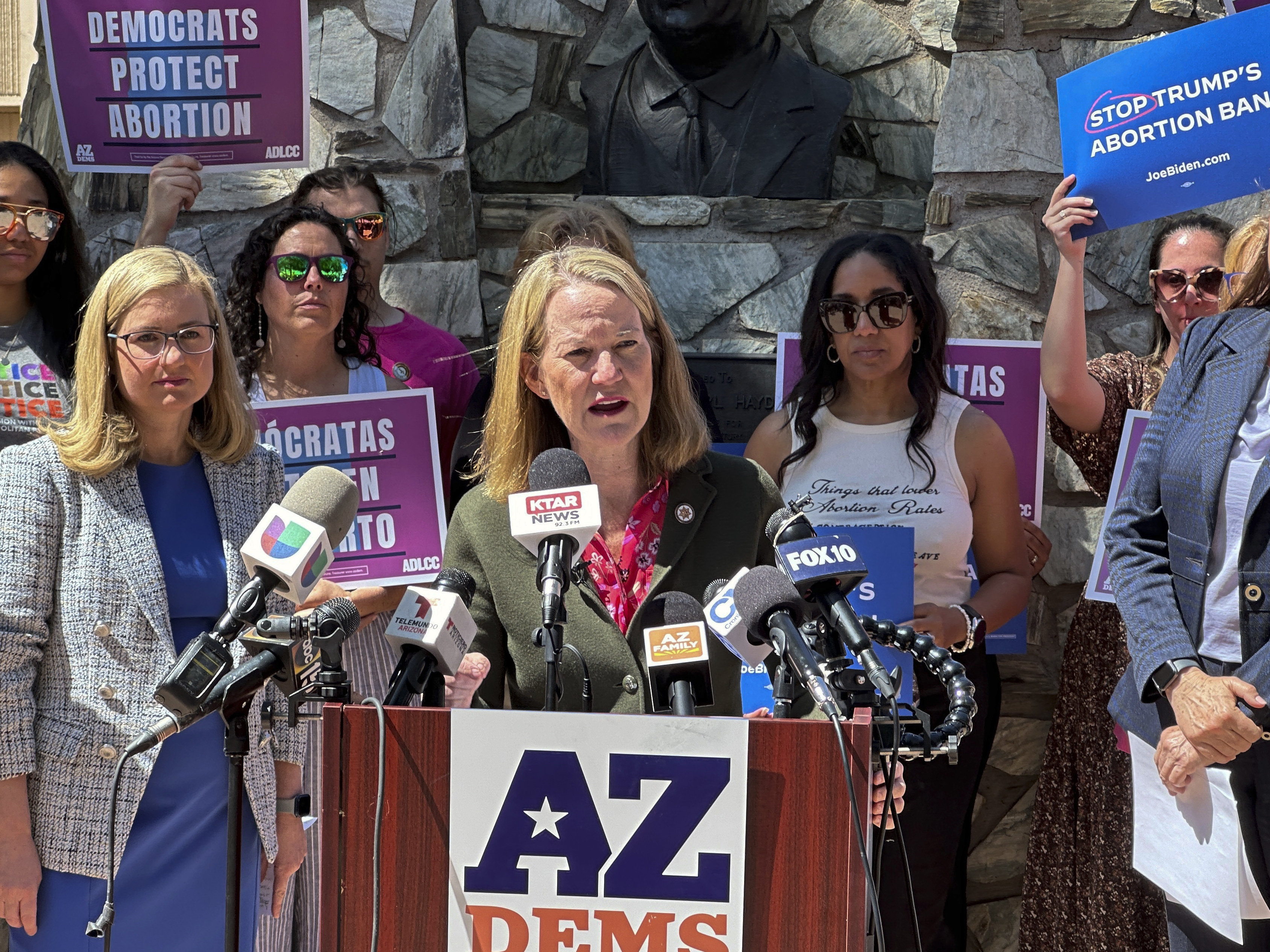 caption: Arizona's Democratic Attorney General Kris Mayes, speaking in Phoenix last month after the state's supreme court ruled that an 1864 ban on abortion could be enforced, had pledged not to enforce the law. Now the legislature has voted to repeal it.