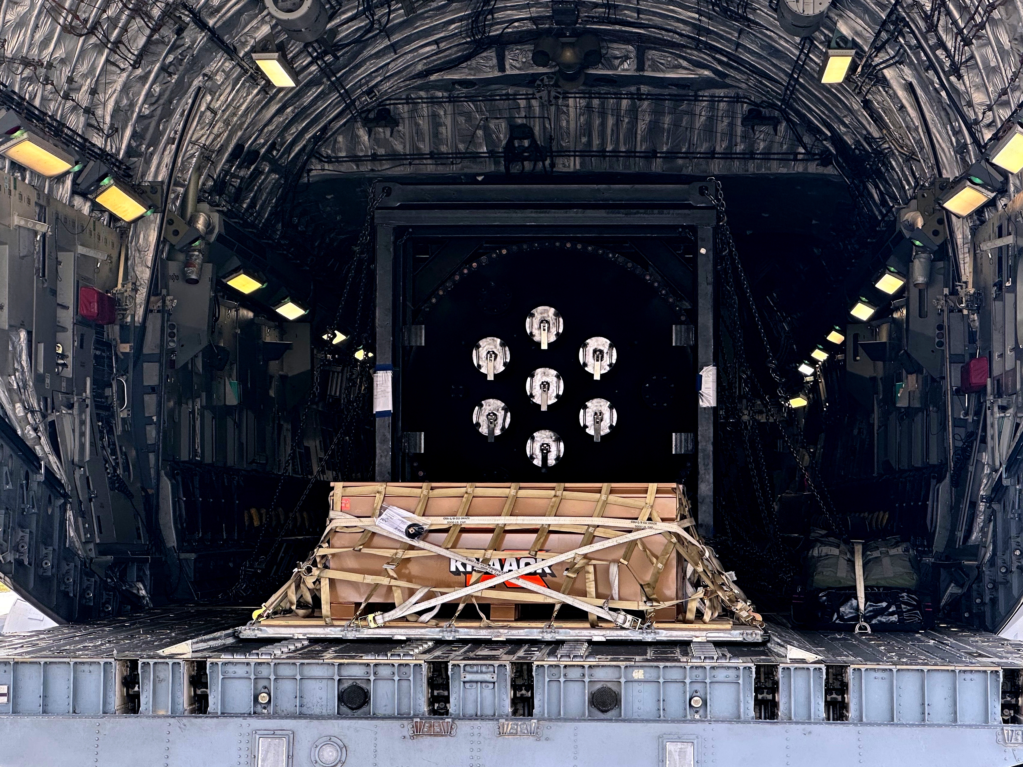 caption: A Valar Atomics microreactor is seen on a C-17 aircraft, without nuclear fuel, at March Air Reserve Base, Calif., Sunday, Feb. 15, 2026.  The reactor was transported from March Air Reserve Base to Hill Air Force Base in Utah.