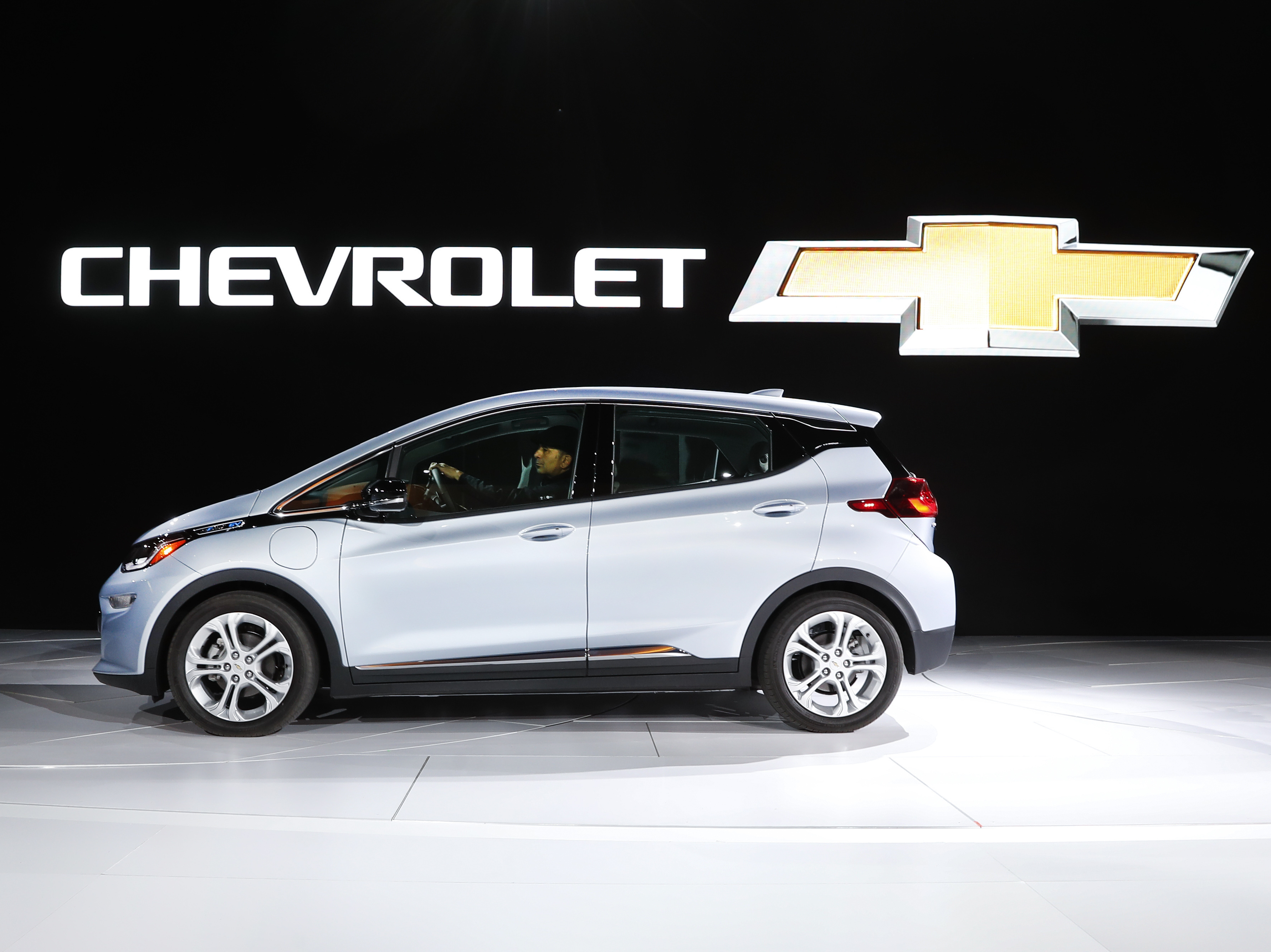 caption: Chevrolet shows off its Chevrolet Bolt at the North American International Auto Show on Jan. 9, 2017, in Detroit. GM will introduce a new-generation Bolt after earlier saying it would halt production.