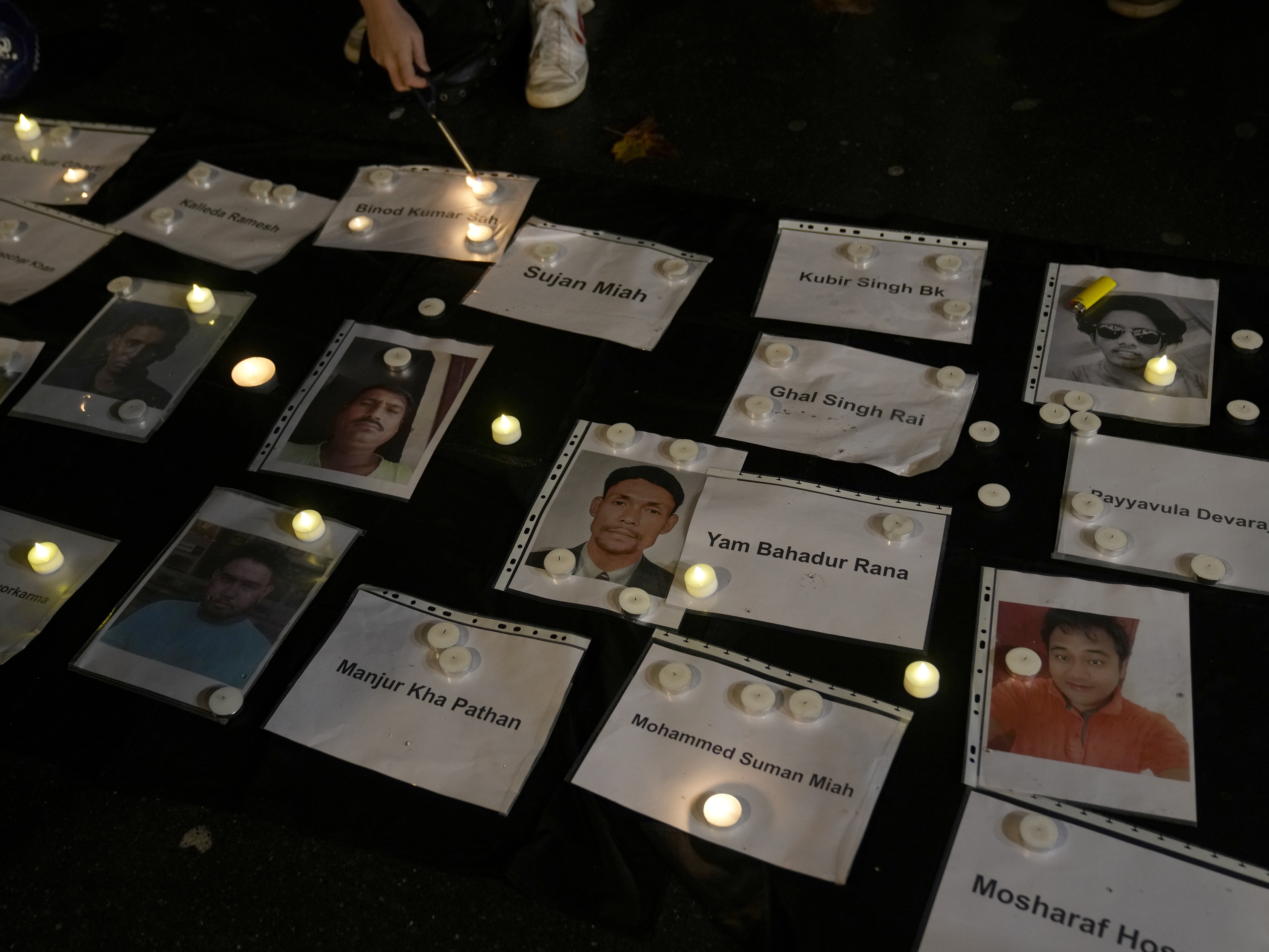 caption: Activists protested against the World Cup, which starts Sunday in Qatar, and called for a boycott during a demonstration outside the Qatar Embassy in Paris on Nov. 15, 2022.