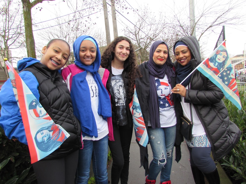 caption: Sabreen Tuku of Issaquah, second from left, came to the Seattle Womxns March with family and friends. She's attended all three years.