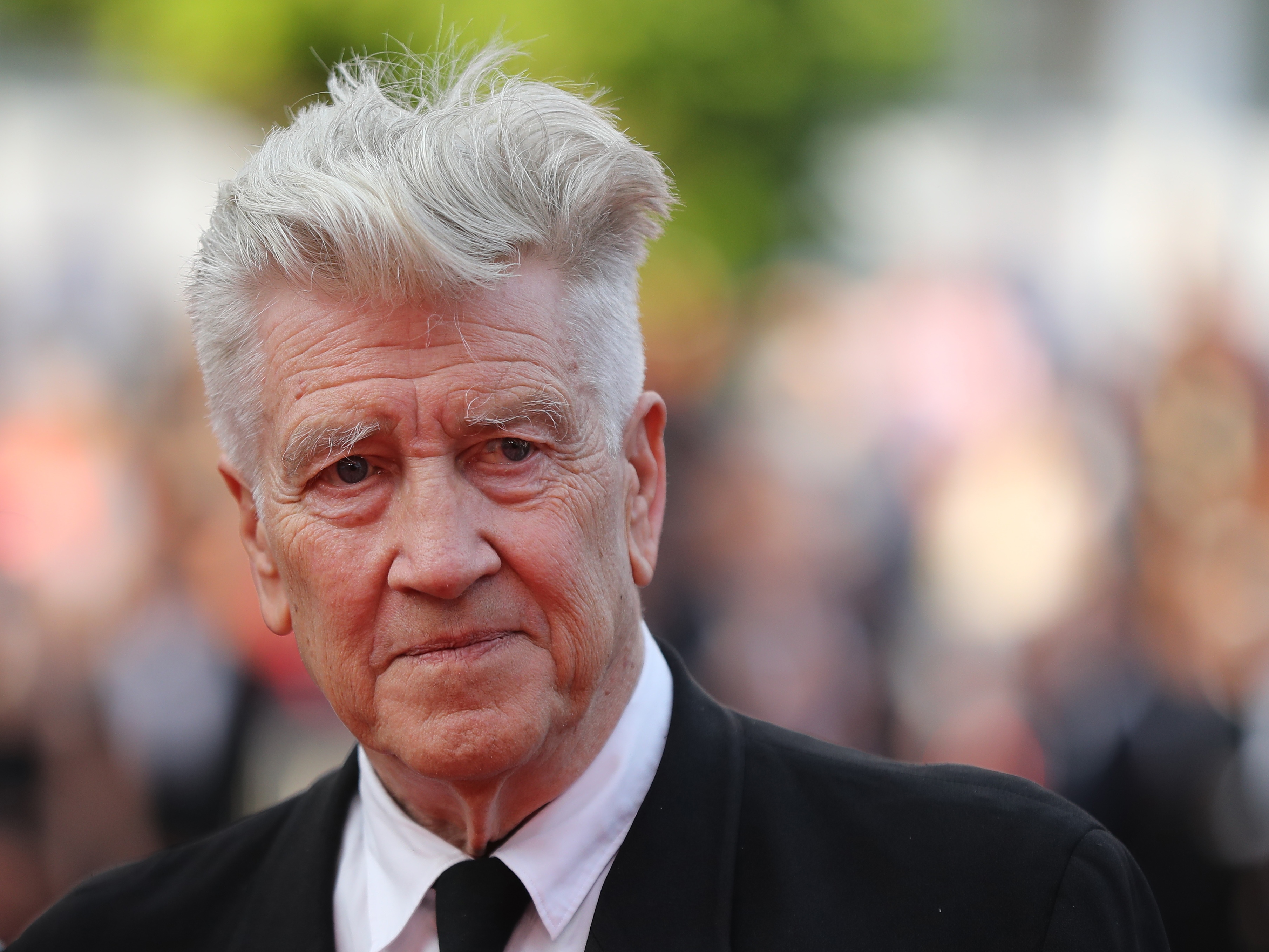 caption: Director David Lynch has died at the age of 78. He's pictured above at the Cannes Film Festival in 2017.<br>
