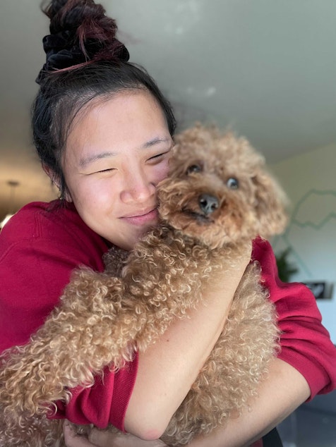 caption: KUOW staffer Lisa Wang hugging her pup Franklin. 

UW psychology professor Nicole McNichols says people need touch, but not all touch has to come from other people. She says pets can provide much needed comfort and contact too. 