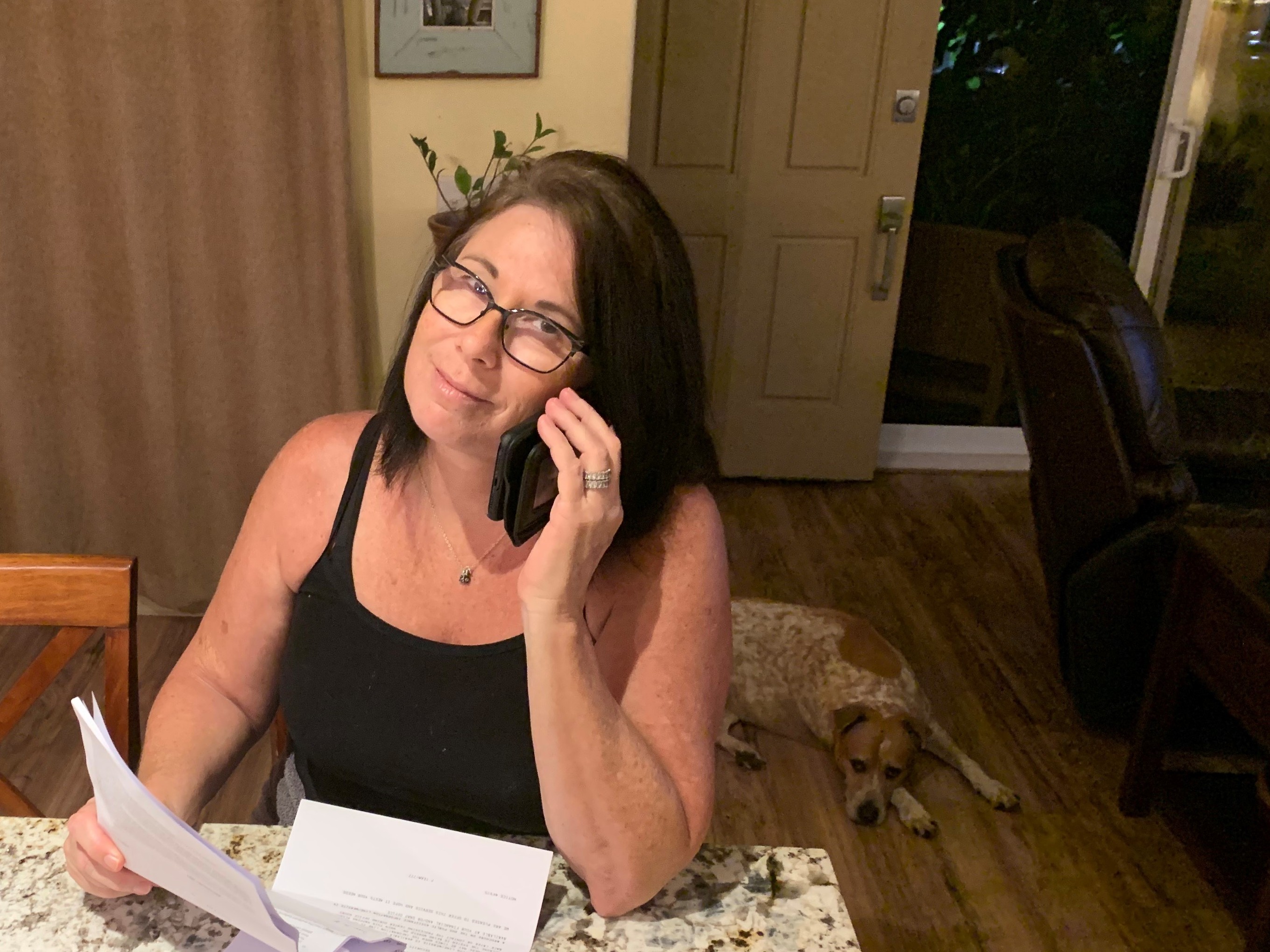 caption: Julia Hansen says her lender, Freedom Mortgage, told her that to get federally mandated help she'd have to make an $8,000 payment in three months or "go into foreclosure."