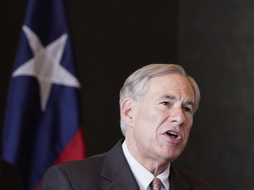 caption: Texas Gov Greg Abbott, pictured in March, has threatened to block the pay of lawmakers who left the state House chamber rather than vote on a bill they say would make it harder to vote.