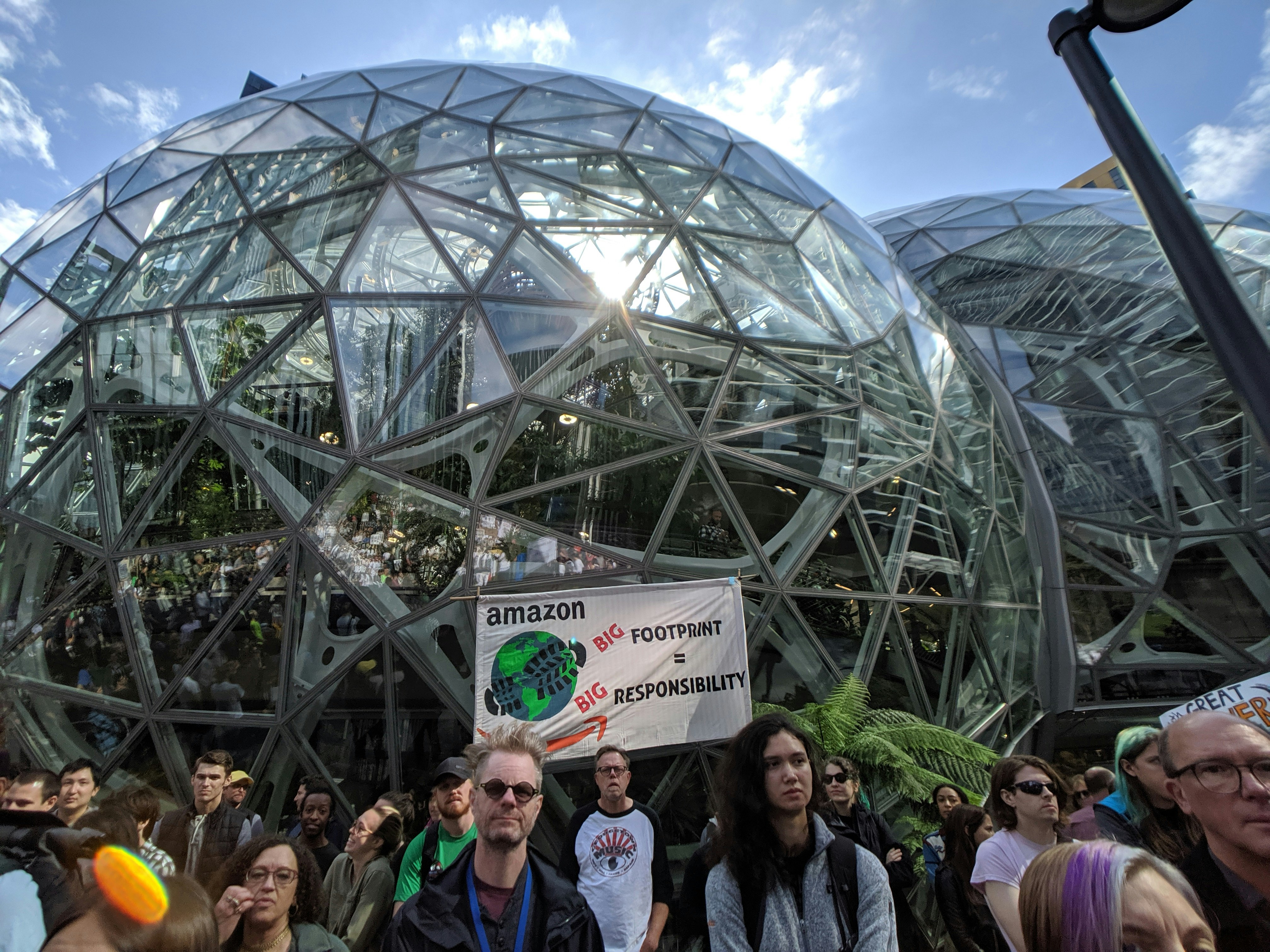 KUOW - Hundreds of Amazon employees pledge to walk out over company's carbon footprint, in-person work policy - Vimarsana News