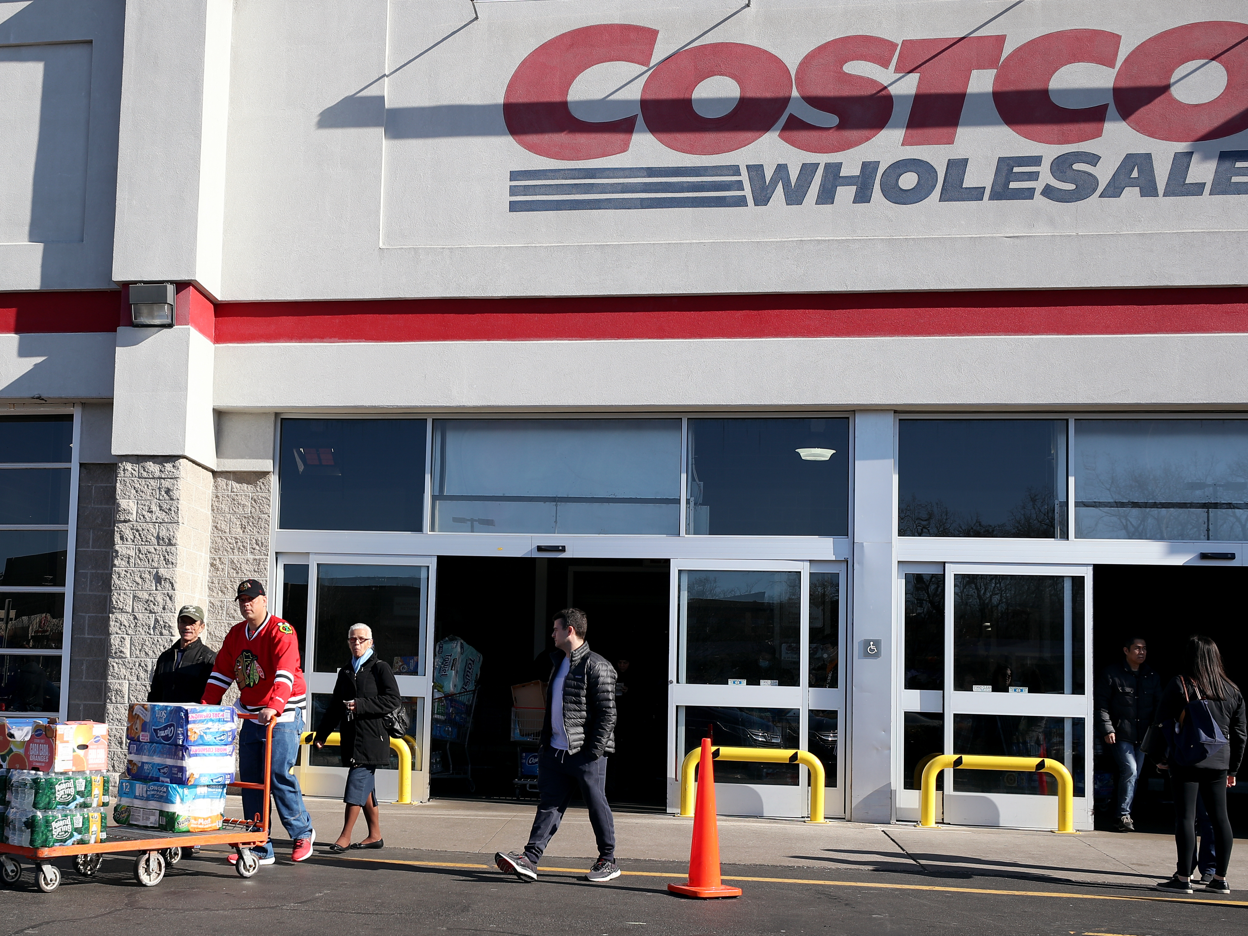 caption: Shoppers lined up to buy supplies at Costco Wholesale in New Jersey last year as fears over COVID-19 grew around the world. The company recently reintroduced limits on toilet paper, cleaning supplies and other products as it copes with supply chain challenges.