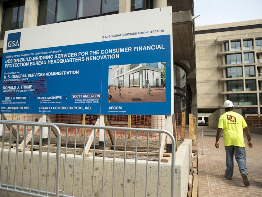 A sign stands at the construction site for the Consumer Financial Protection Bureau's new headquarters in Washington