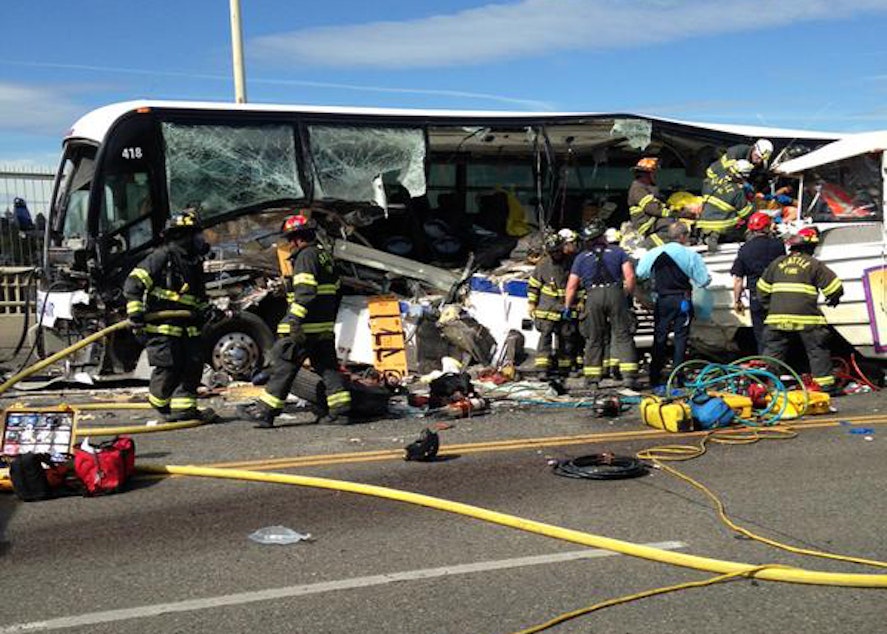 caption: A photo from the Seattle Fire Department's Twitter feed shows the side of a bus ripped open after a collision with a duck amphibious vehicle on the Aurora Bridge in Seattle, September 24, 2015.