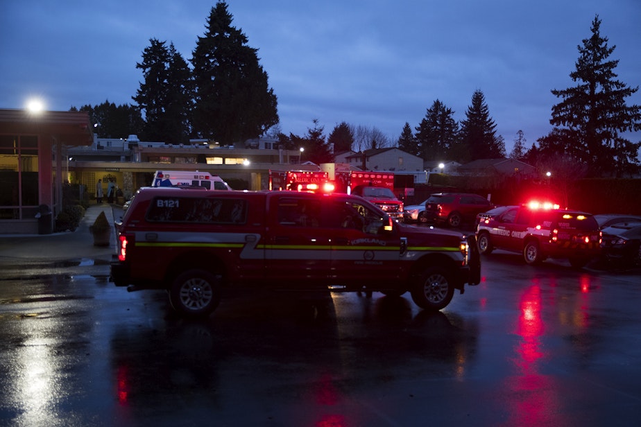 caption: Ambulances respond to the Life Care Center of Kirkland on Monday, March 2, 2020, in Kirkland. 