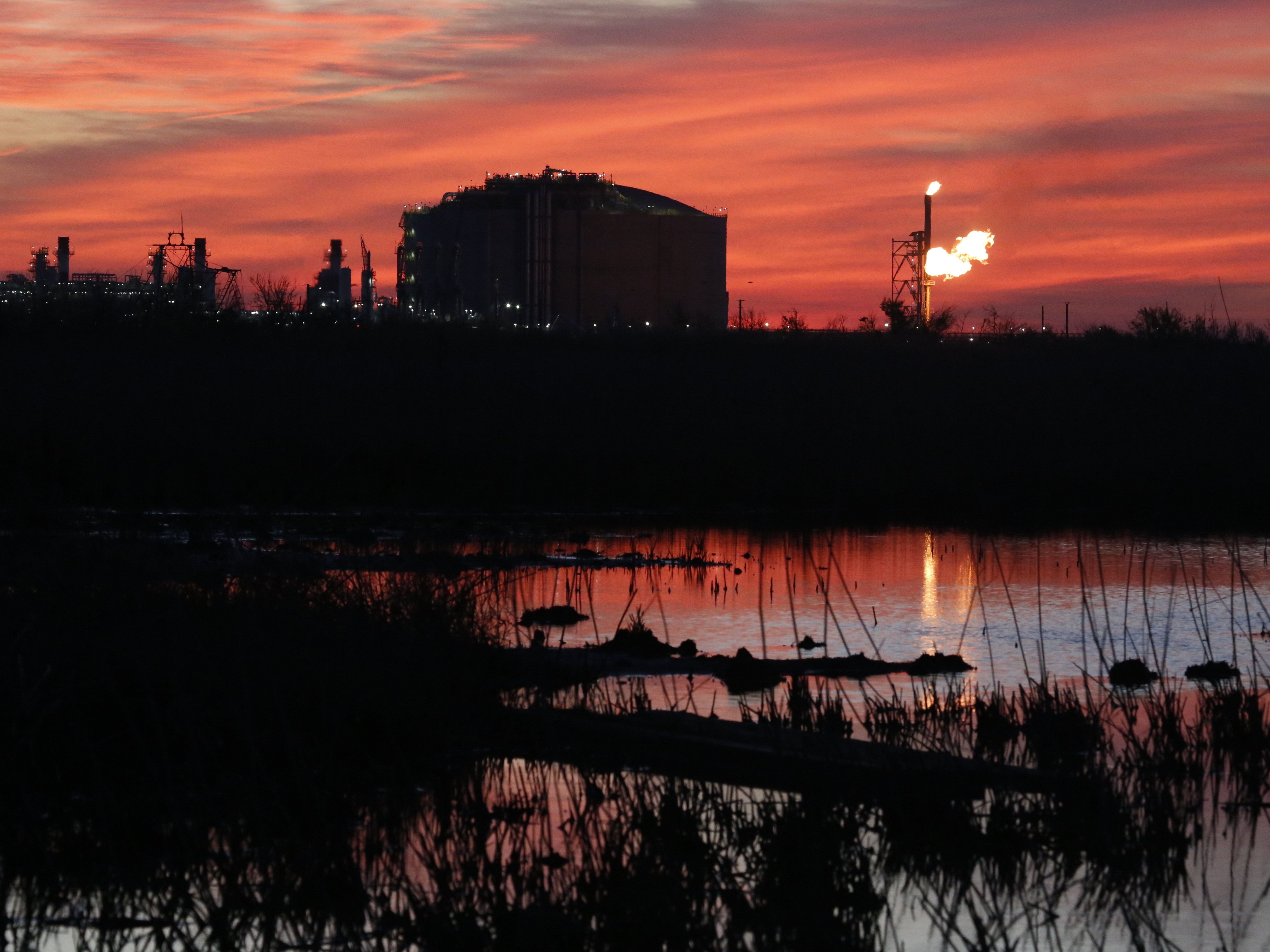 caption: A flare burns at Venture Global LNG in Cameron, La., April 21, 2022. What would be the nation's largest export terminal for liquified natural gas won approval from a federal commission on June 27, 2024, although when the southwest Louisiana project will be completed remains unclear.