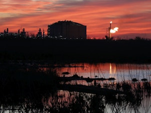 caption: A flare burns at Venture Global LNG in Cameron, La., April 21, 2022. What would be the nation's largest export terminal for liquified natural gas won approval from a federal commission on June 27, 2024, although when the southwest Louisiana project will be completed remains unclear.
