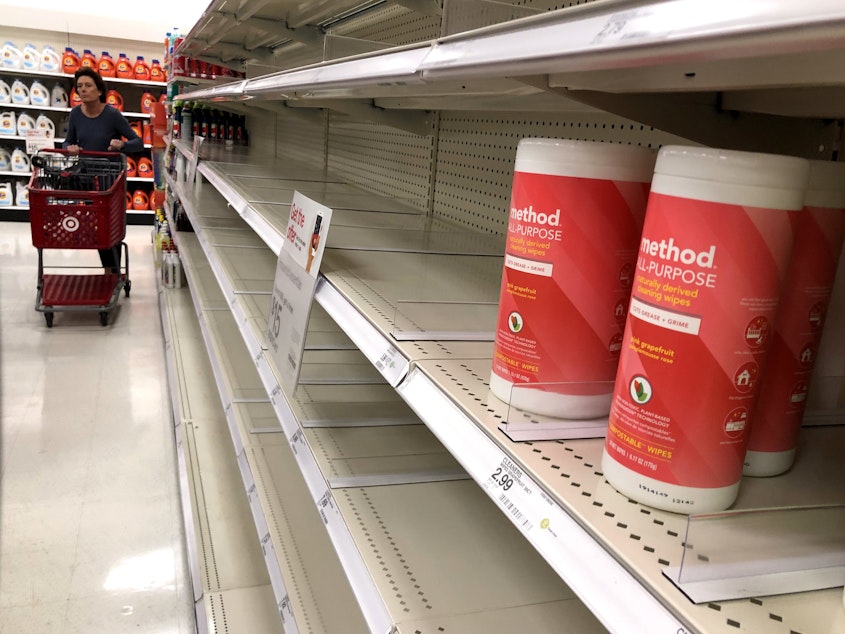 caption: California now has at least 29  cases of the coronavirus that causes COVID-19. Here, shelves of disinfectant wipes are nearly empty at a Target store in Novato, Calif., earlier this week, as fears of the virus prompted shoppers to stock up on sanitizing options.