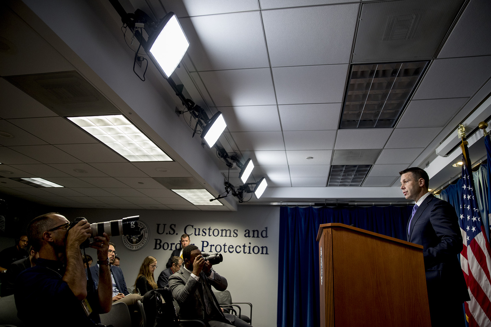 caption: Acting Homeland Security Secretary Kevin McAleenan speaks about upcoming changes to the Flores ruling at a news conference at the Reagan Building in Washington, Wednesday, Aug. 21, 2019. (Andrew Harnik/AP)