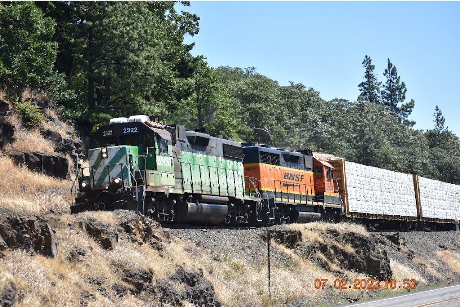 caption: A BNSF Railway train, photographed about 20 minutes, state investigators say, before it ignited the Tunnel 5 fire in Skamania County, Washington, on July 2, 2023.