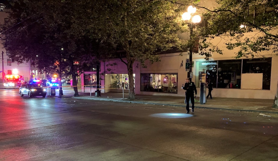 caption: Police investigate after a shooting near a nightclub in Seattle's SoDo neighborhood. 