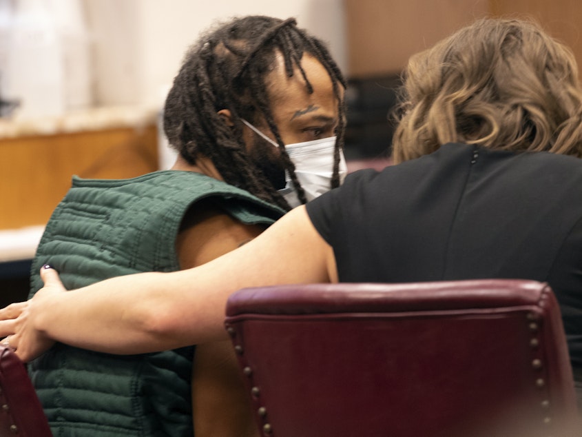 caption: Darrell Brooks, left, speaks with a lawyer during his initial appearance, Tuesday, Nov. 23, 2021 in Waukesha County Court in Waukesha, Wis. Brooks is charged with intentional homicide after SUV was driven into a Christmas parade.