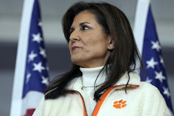 caption: Republican presidential candidate former UN Ambassador Nikki Haley waits as she's introduced at a campaign rally on Tuesday in Clemson, S.C.