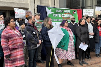caption: A coalition of elected officials and activists called on Washingtonians to vote "uncommitted" in the Democratic presidential primary on March 4, 2024. Washington state's presidential primary election will be held on March 12. 