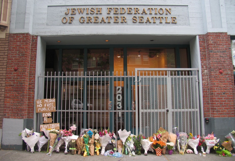 caption: Flowers outside Jewish Federation Building commemorate the 2006 hate-crime shooting .
