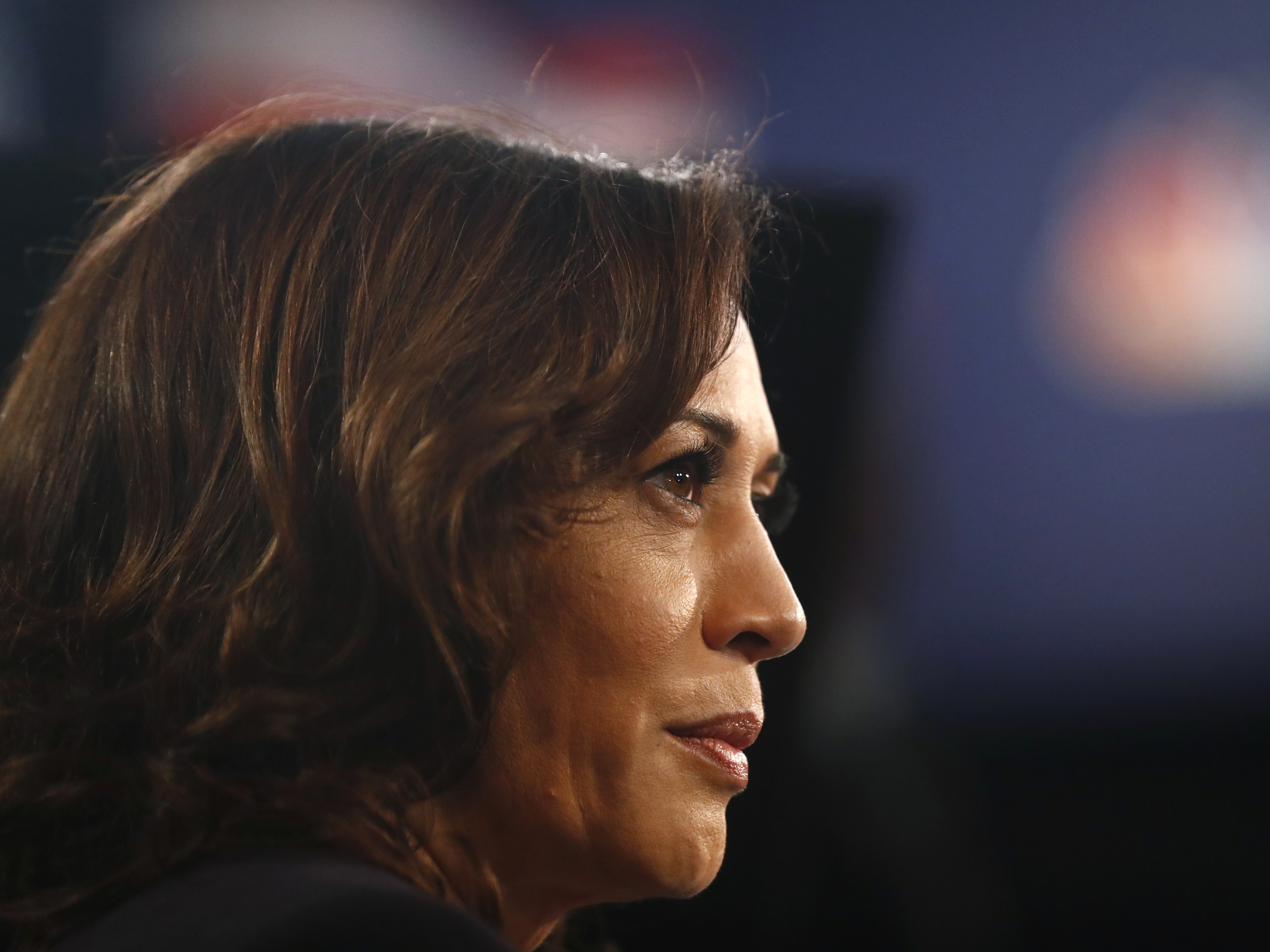 caption: Democratic presidential candidate Sen. Kamala Harris of California listens to questions in the spin room after the Democratic primary debate in Miami on Thursday.