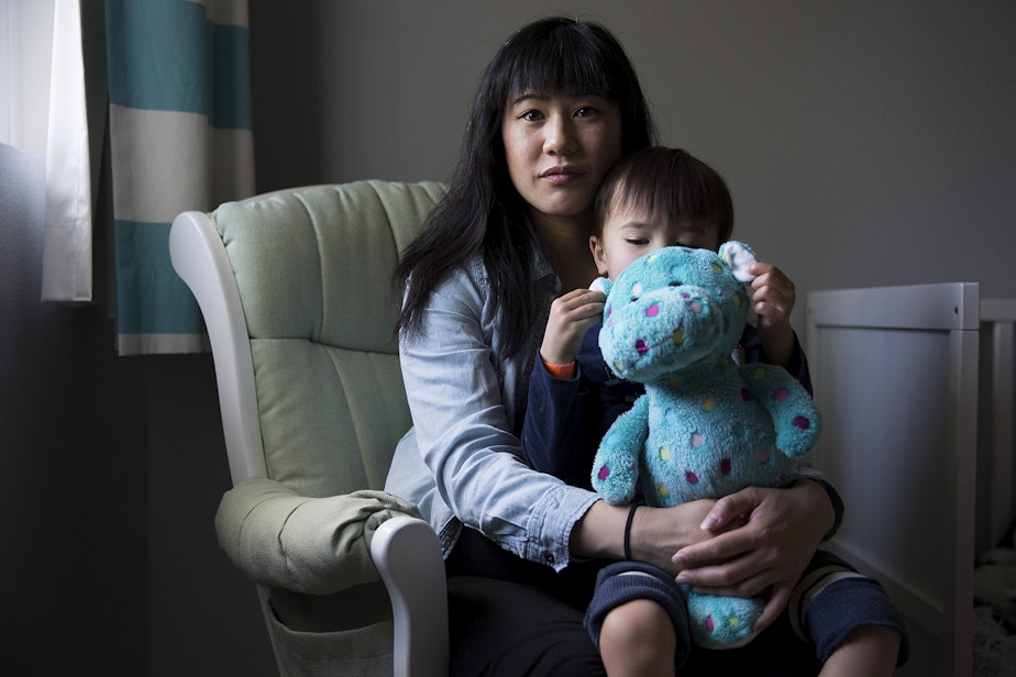 caption: Patty Liu poses for a portrait with her son Everett, 2, on Thursday, May 2, 2019, at her home in Seattle.