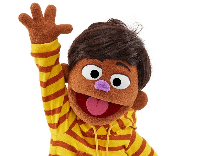 caption: TJ is <em>Sesame Street</em>'s first Filipino muppet.