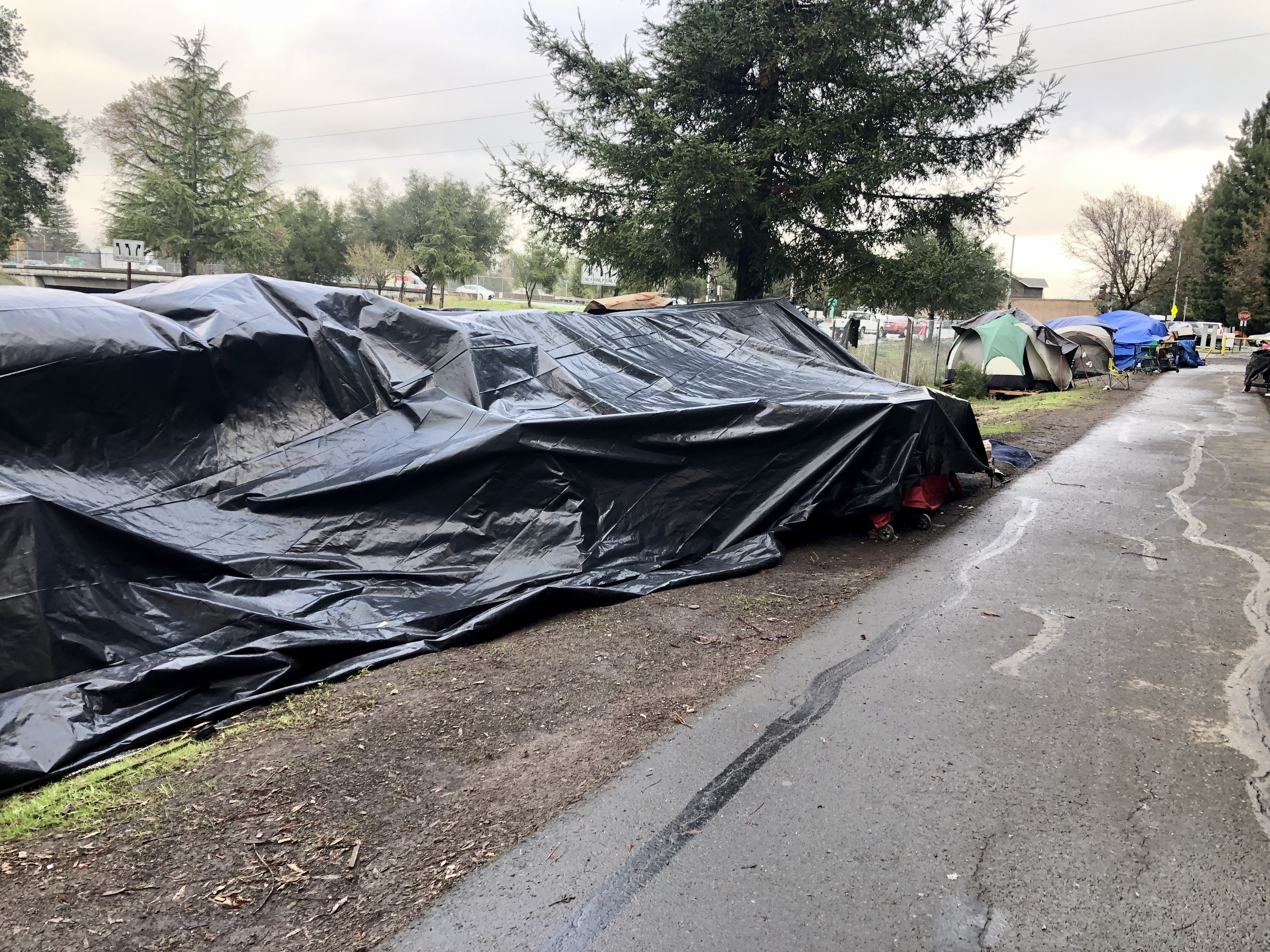 caption: In Sonoma County, Calif., officials are struggling to address a homeless encampment with roughly 200 residents.