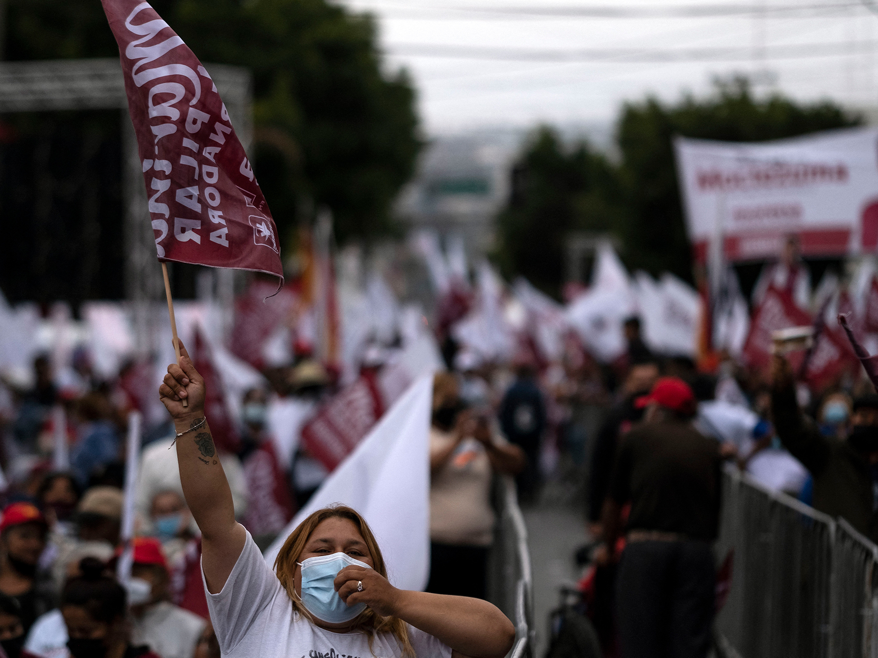 caption: Supporters of the Morena party's candidate for governor of Baja California, Marina del Pilar Ávila, attend the closing campaign rally in Tijuana, Baja California, Mexico, on Wednesday.