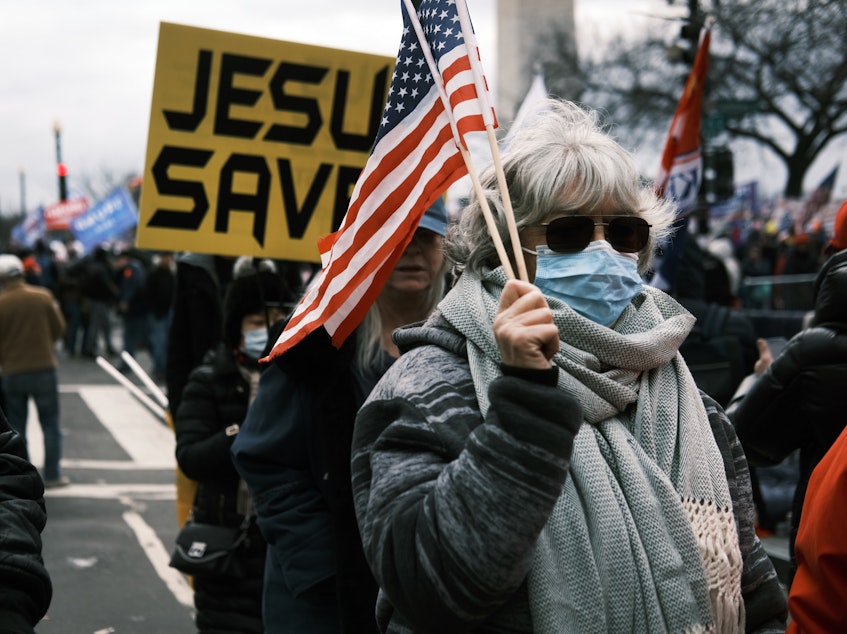 caption: JESUS SAVES banners were among those carried during the the "Stop the Steal" rally on Jan. 06, 2021 in Washington, D.C.