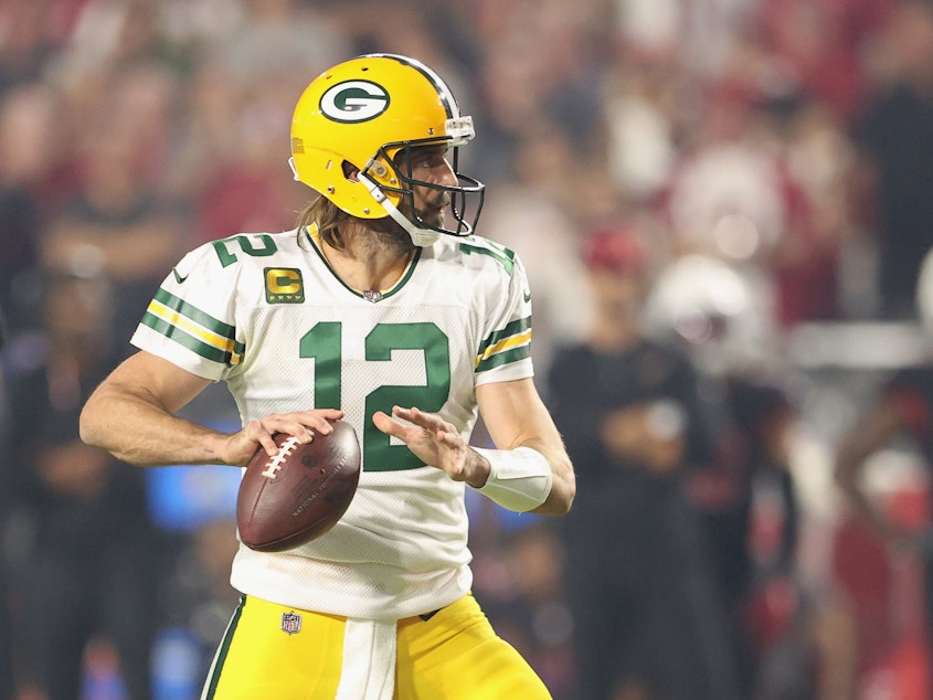 caption: Quarterback Aaron Rodgers of the Green Bay Packers has reportedly tested positive for COVID-19.