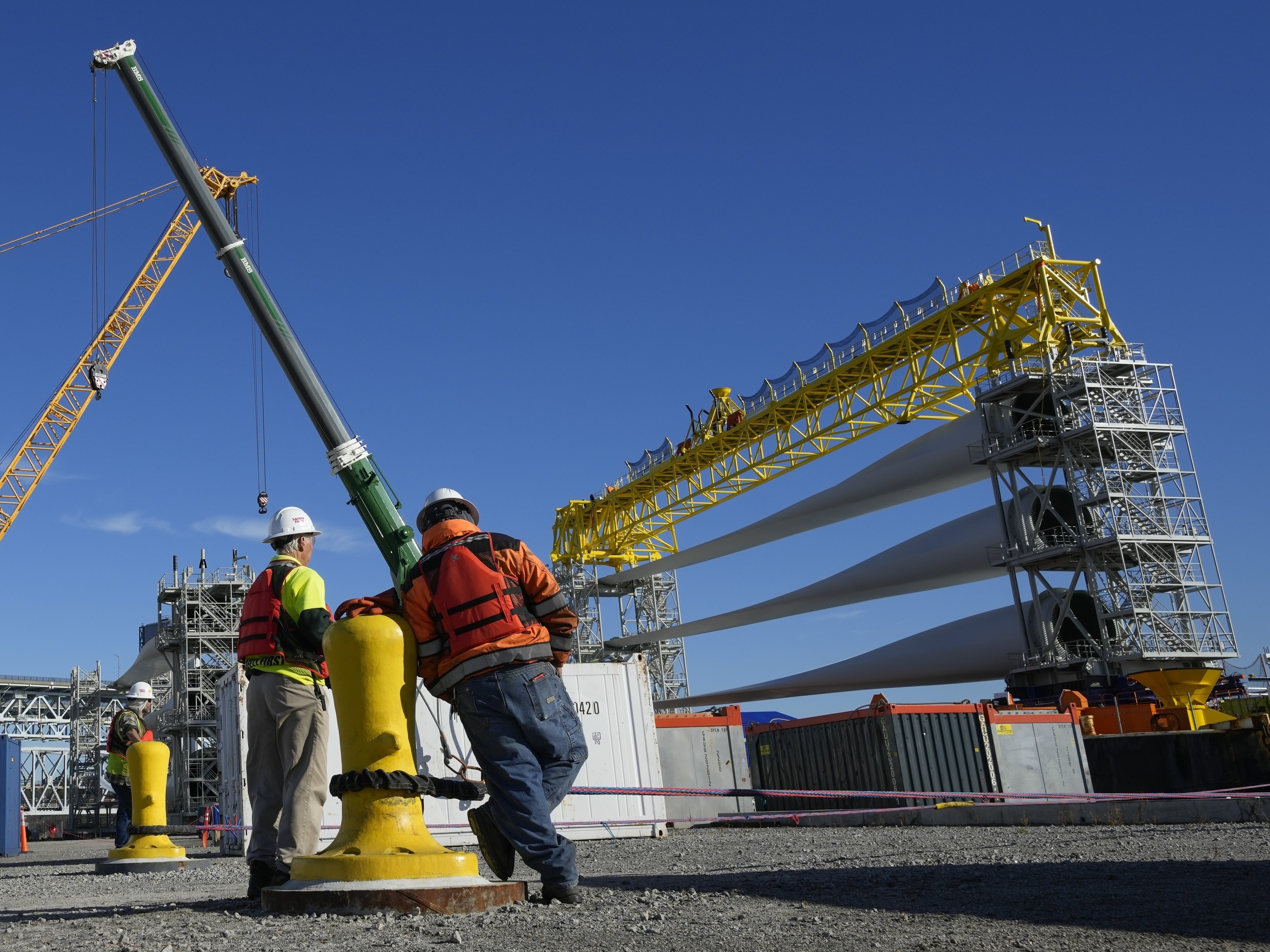 caption: Offshore wind blades and other equipment in New London, Conn. President Trump is a longtime critic of the wind industry.