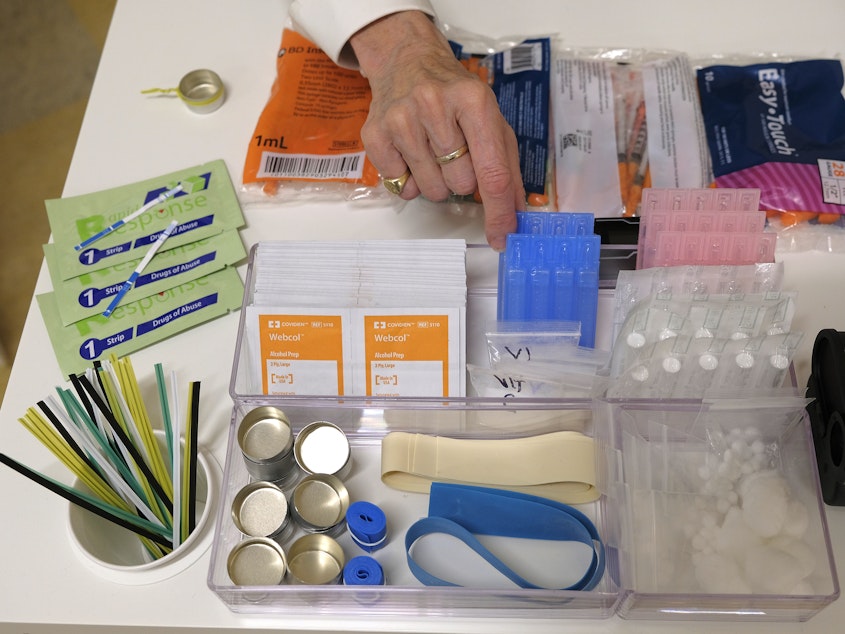 caption: Supplies sit on a check-in desk at a model of a hypothetical injection site in San Francisco, pictured here in September 2018. Local leaders from San Francisco are among a dozen local officials urging a federal court to allow an effort to open a supervised injection site in Philadelphia.