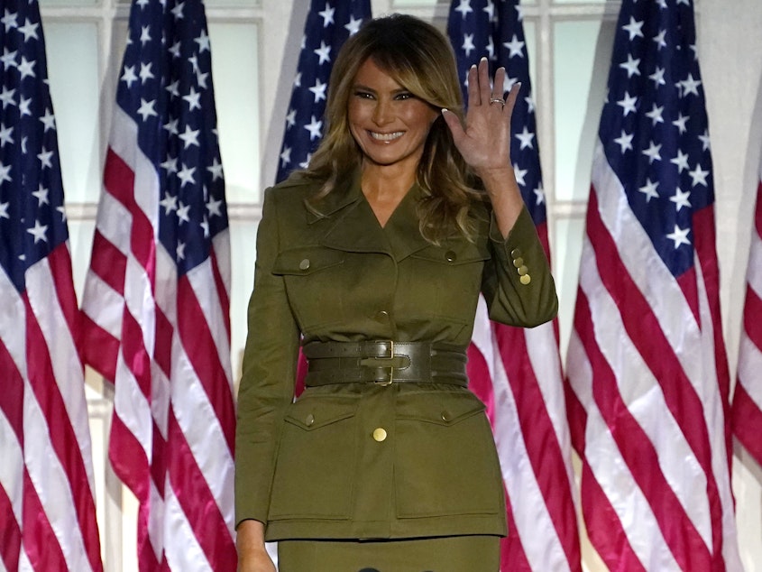 caption: First lady Melania Trump arrives to speak on the second night of the Republican National Convention from the Rose Garden of the White House on Tuesday.