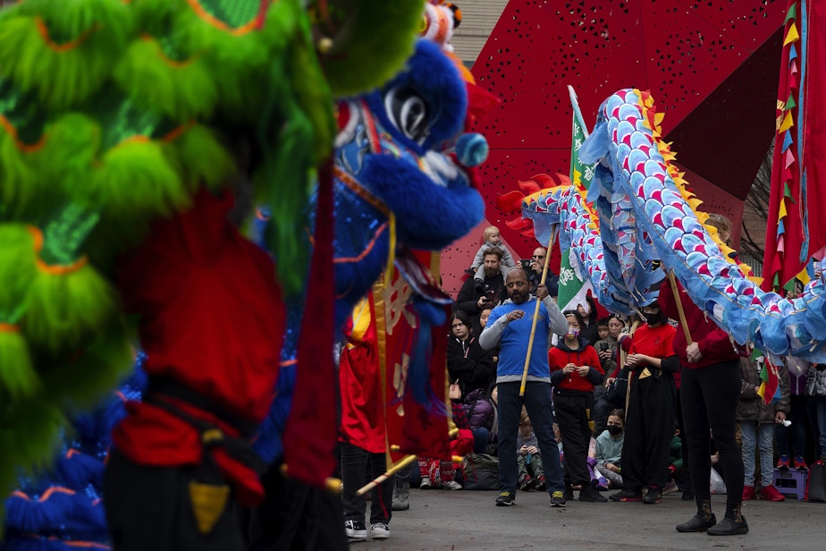 caption: Members of Northwest Kung Fu and Fitness perform a lion dance during the Lunar New Year celebration on Saturday, Feb. 4, 2023, in Seattle’s Chinatown-International District. 