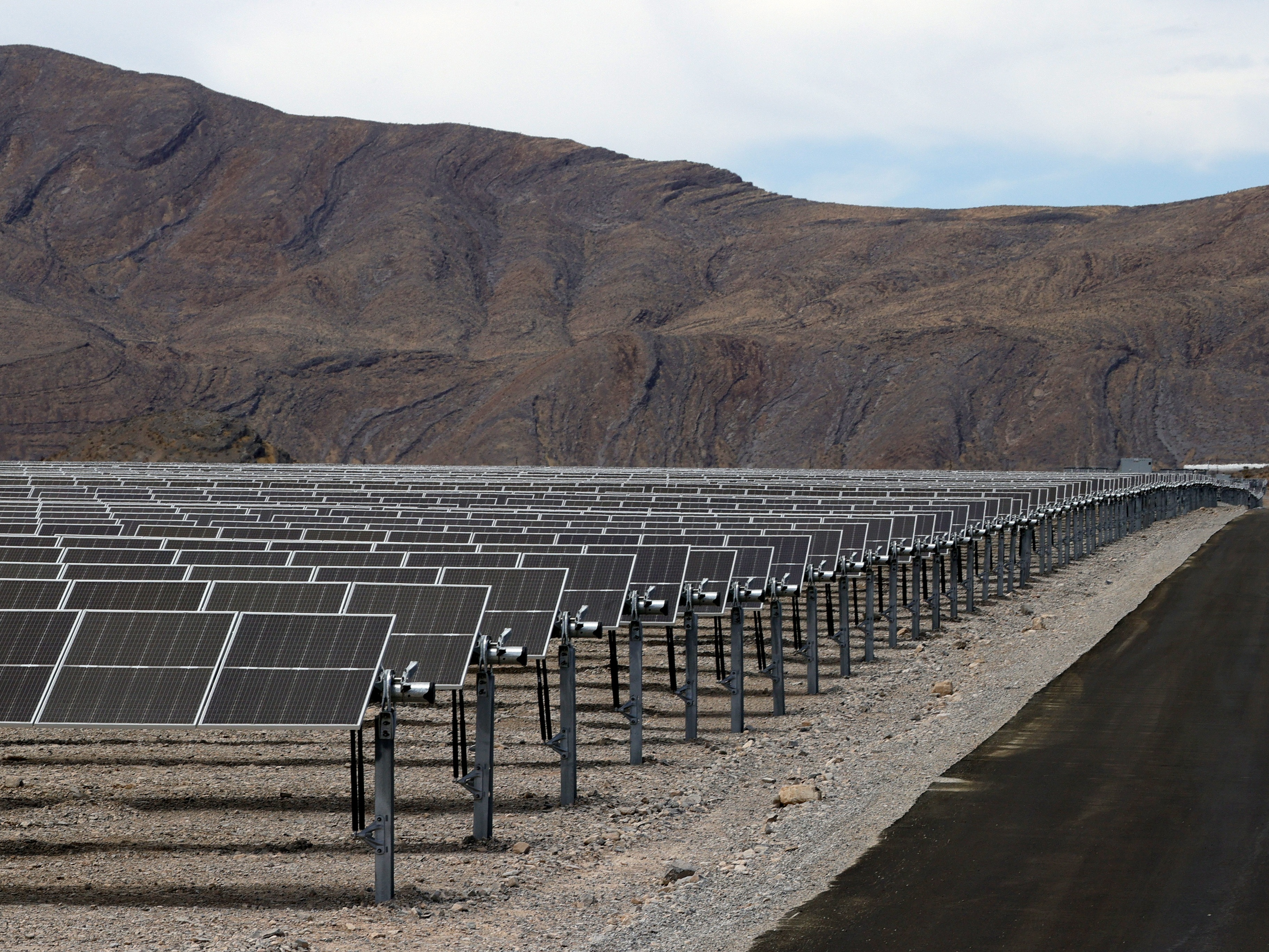 caption: Panels in MGM Resorts' Mega Solar Array are shown after it was launched on June 28, 2021 in Dry Lake Valley, Nevada. The project sits on 640 acres of desert about 30 miles north of the Las Vegas Strip in the Dry Lake Solar Energy Zone.  (Photo by Ethan Miller/Getty Images)